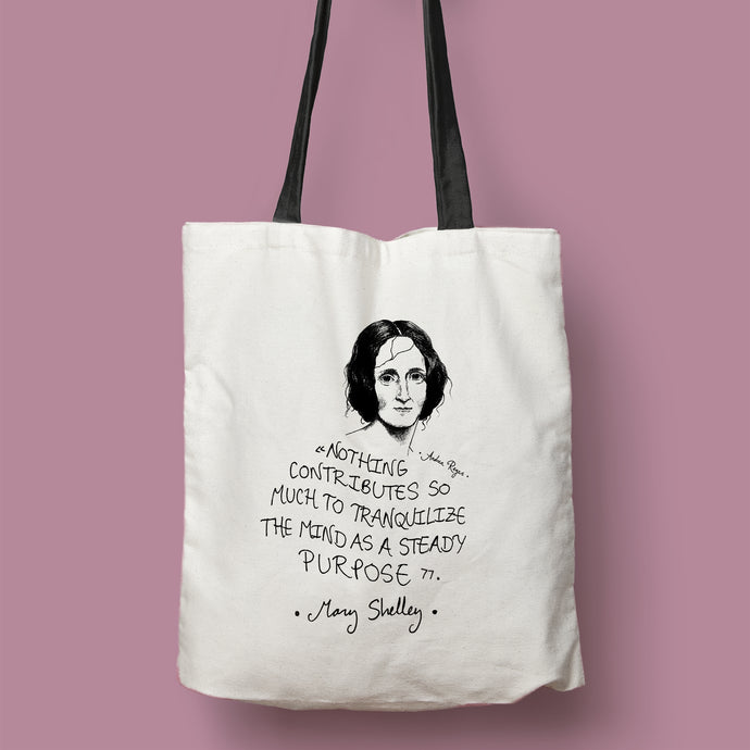Tote bag natural con asa negra con ilustración y cita de Mary Shelley en inglés.