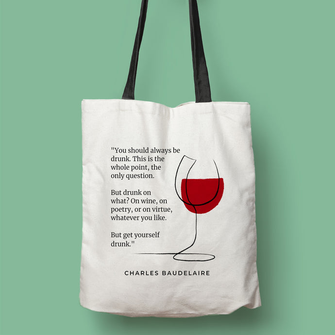 Tote bag color natural con asa negra de la colección Quotes & Co con ilustración de copa de vino y cita de Charles Baudelaire.
