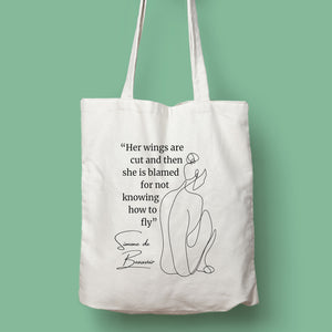 Tote bag color natural con asa natural de la colección Quotes & Co con ilustración de silueta de mujer y cita de Simone de Beauvoir.