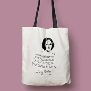 Tote bag natural con asa negra con ilustración y cita de Mary Shelley en español.
