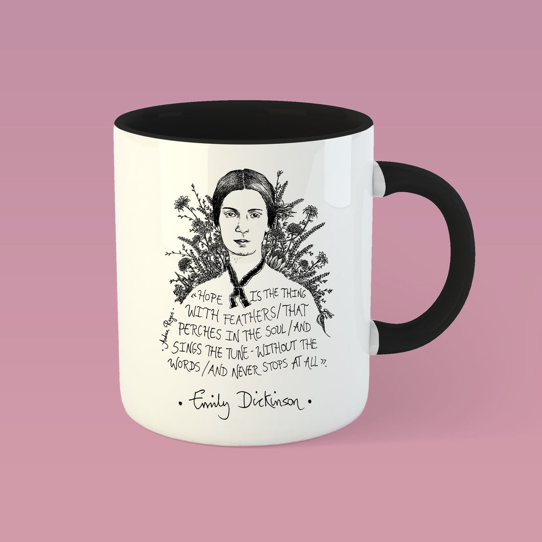 Taza blanca con interior y asa negra con ilustración y cita de Emily Dickinson en inglés.