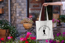Cargar imagen en el visor de la galería, Tote bag natural con asa natural con la ilustración del personaje Lectorix y el texto &quot;Cambia tu perspectiva&quot;