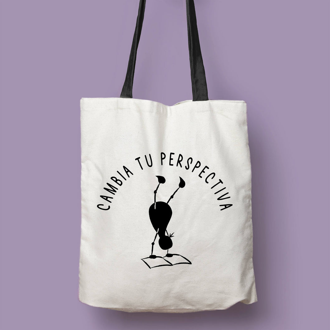 Tote bag natural con asa negra con la ilustración del personaje Lectorix y el texto 