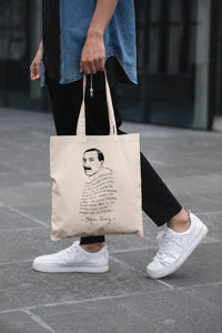 Tote bag de color natural con asa negra con ilustración y cita de Stefan Zweig en español.