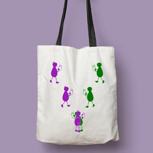 Tote bag natural con asa negra de la colección Lectorix con una pareja de figuras leyendo y abrazándose.
