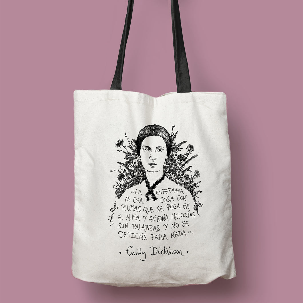 Tote bag natural con asa negra con ilustración y cita de Emily Dickinson en español.