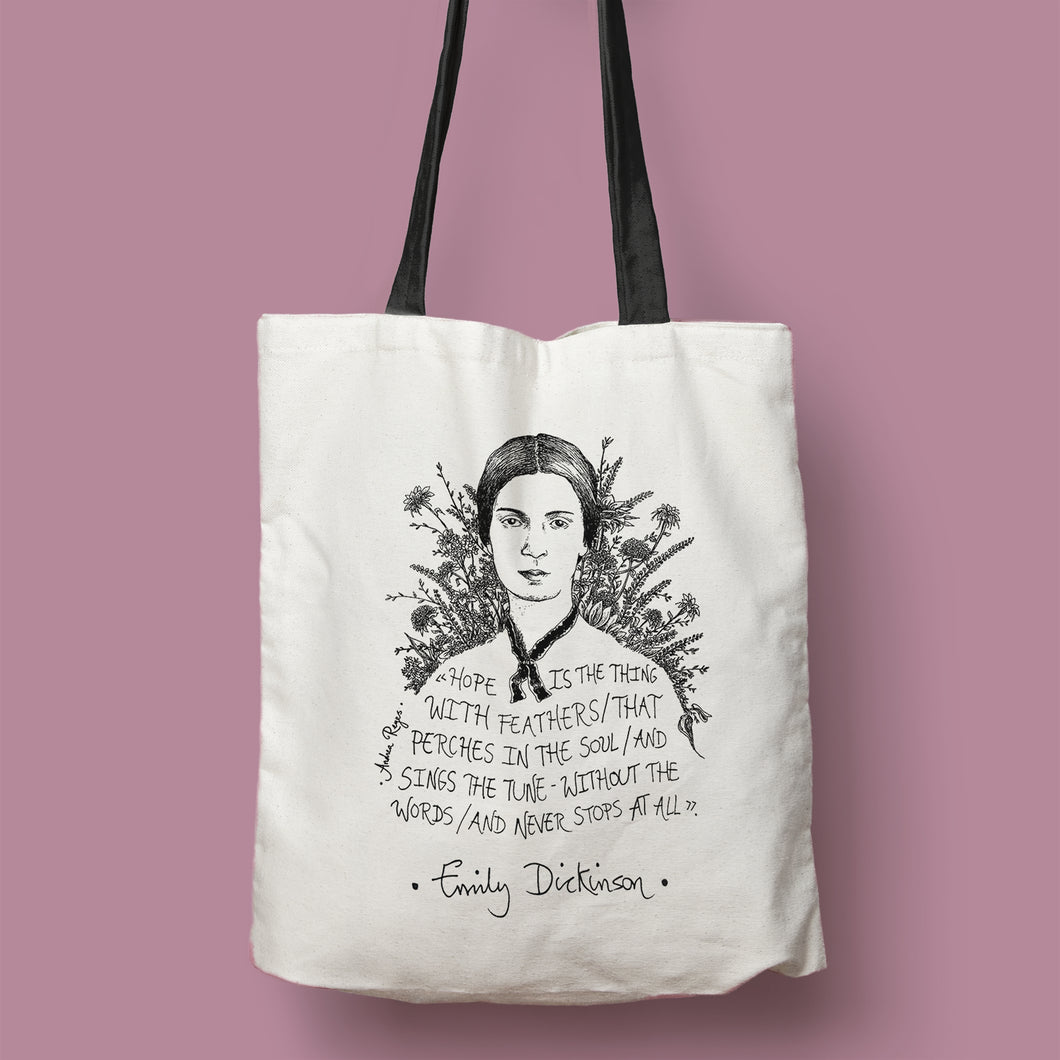 Tote bag natural con asa negra con ilustración y cita de Emily Dickinson en inglés.