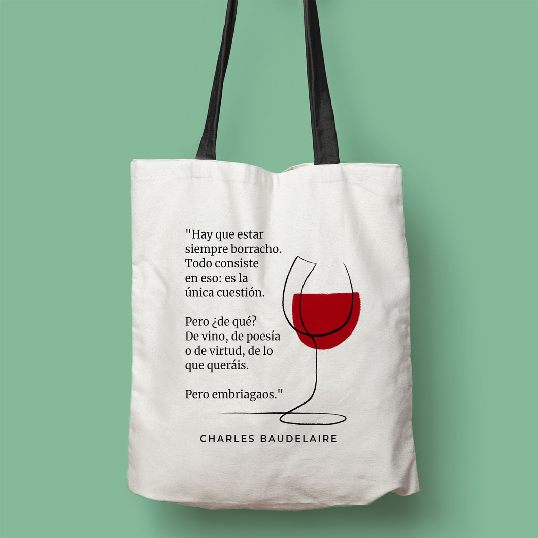 Tote bag color natural con asa negra de la colección Quotes & Co con ilustración de copa de vino y cita de Charles Baudelaire.