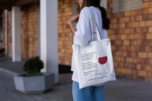 Tote bag color natural con asa natural de la colección Quotes & Co con ilustración de copa de vino y cita de Charles Baudelaire.
