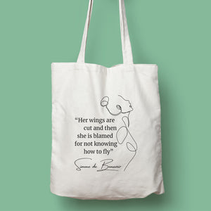 Tote bag color natural con asa natural de la colección Quotes & Co con ilustración de silueta de mujer y cita de Simone de Beauvoir.